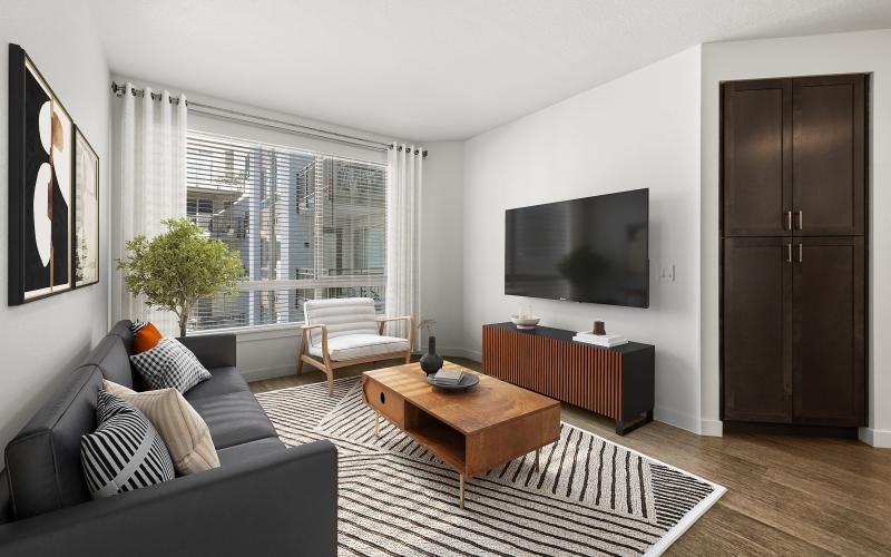 a living room with a tv and couches