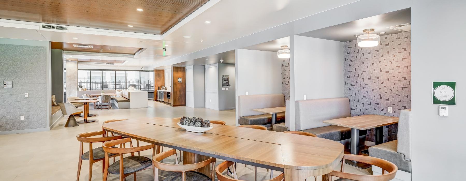 a large kitchen with tables and chairs