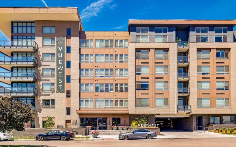 a building with cars parked in front