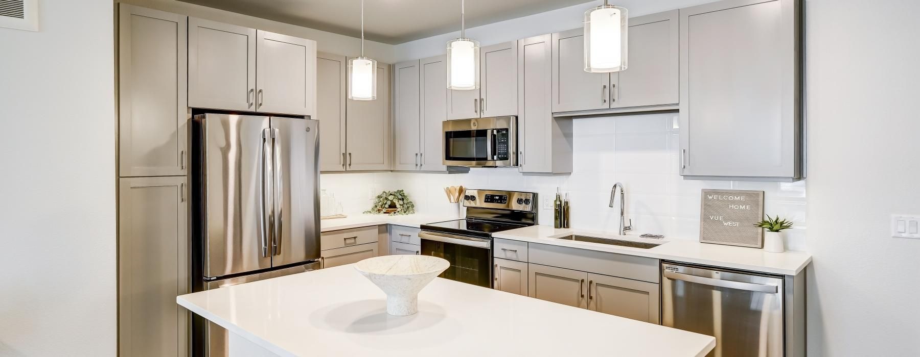 a kitchen with white cabinets