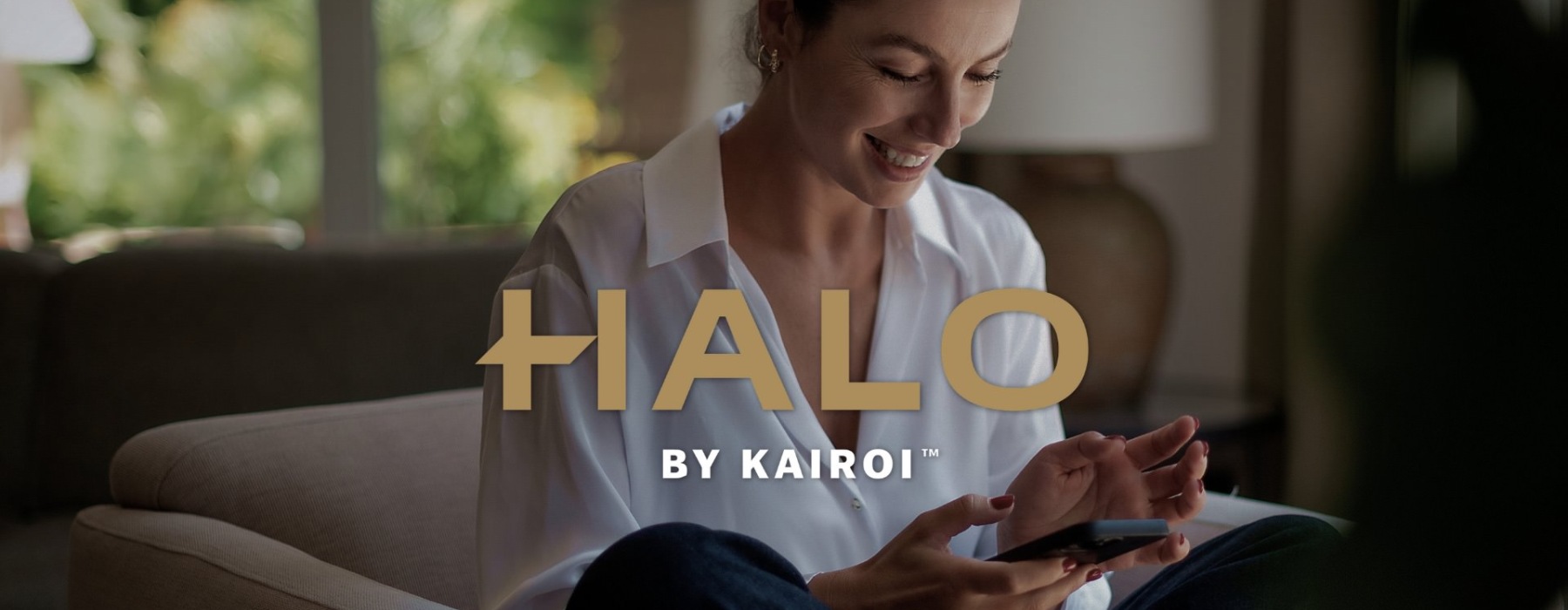 a woman smiling and interacting with her device