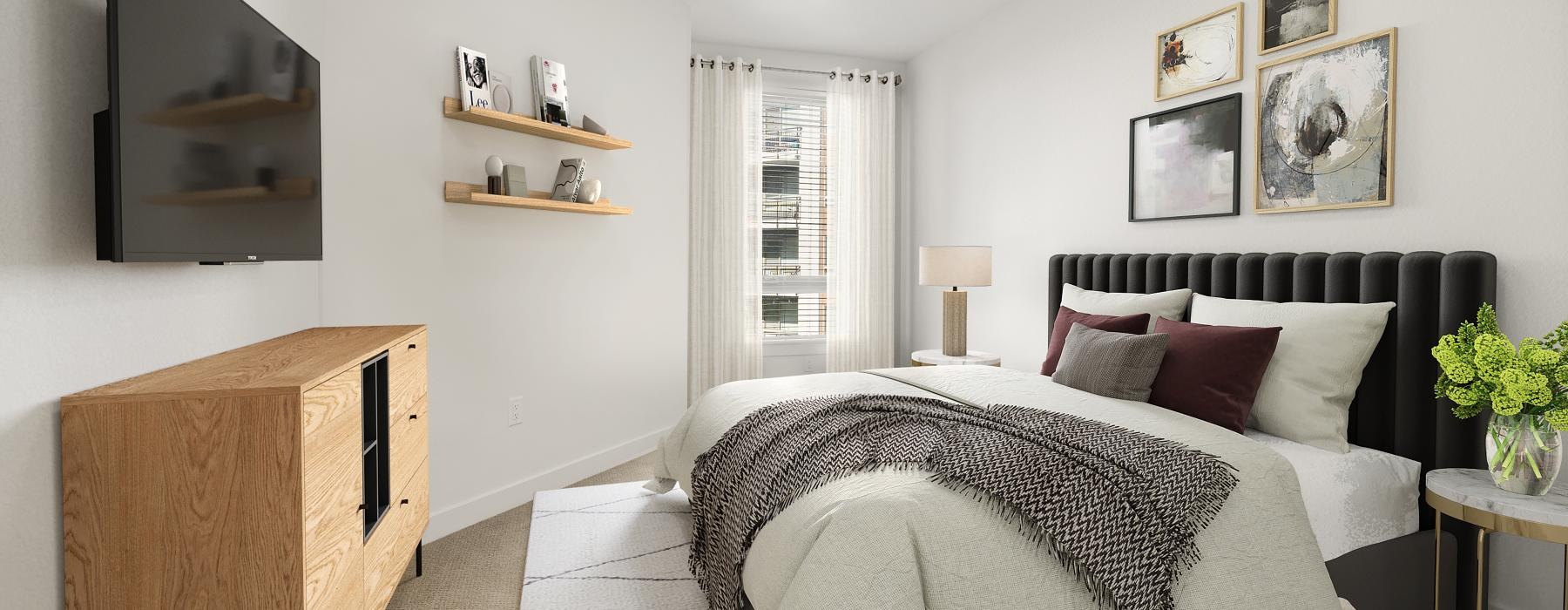 a bedroom with a bed and a shelf with pictures on it