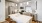 a kitchen with white cabinets